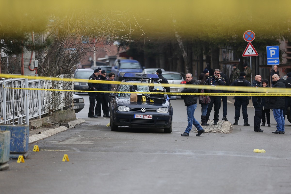 epa06443094 Police investigators search the crime scene for evidence, where Oliver Ivanovic, the former State Secretary for Kosovo and Metohija and a subject of a controversial war crimes trial and re ...