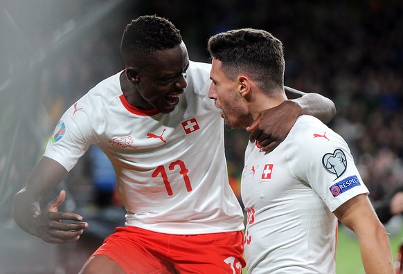 epa07821009 Switzerland&#039;s Fabian Schaer (R) celebrates with teammate Denis Zakaria scoring during the UEFA Euro 2020 qualifying Group D soccer match between Ireland and Switzerland at the Aviva s ...