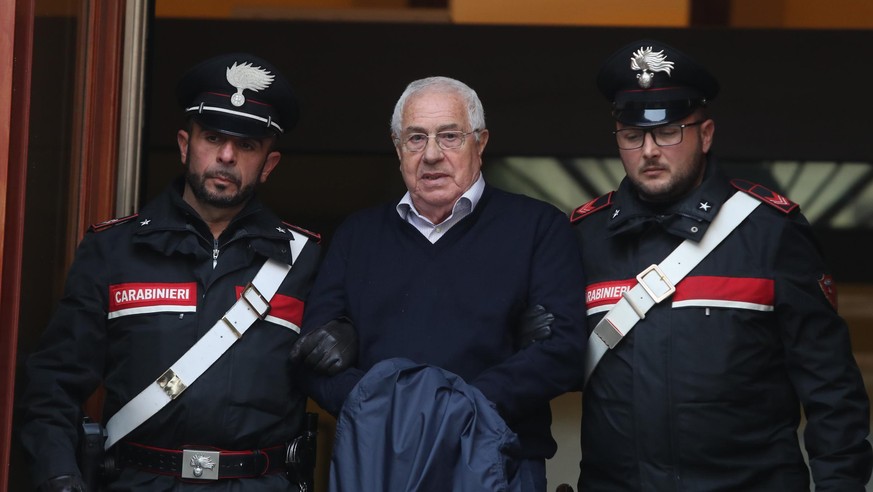 Settimino Mineo, center, who allegedly took over as the Palermo head of Cosa Nostra, is escorted by Italian Carabinieri police after an anti Mafia operation which led the arrest of 46 people including ...