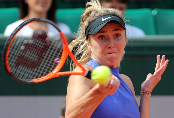 epa06011528 Elina Svitolina of Ukraine in action against Petra Martic of Croatia during their women’s singles 4th round match during the French Open tennis tournament at Roland Garros in Paris, France ...