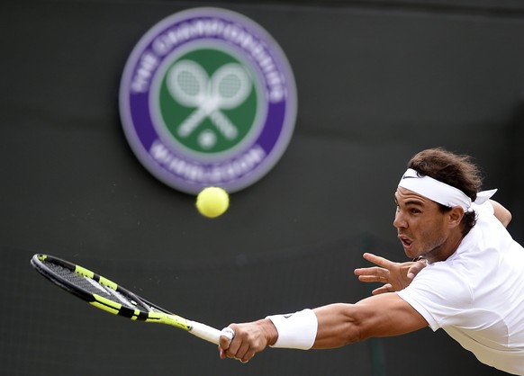 epa06079478 Rafael Nadal of Spain in action against Gilles Muller of Luxembourg during their fourth round match for the Wimbledon Championships at the All England Lawn Tennis Club, in London, Britain, ...