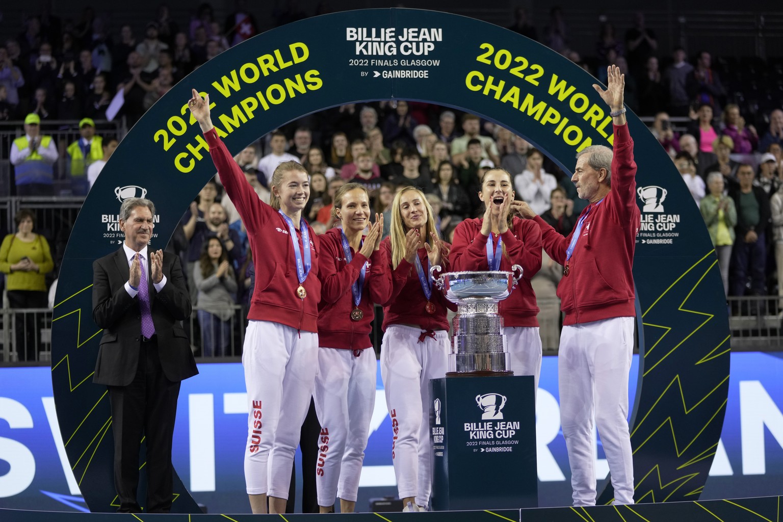 Switzerland&#039;s players Simona Waltert, Viktorija Golubic, Jil Teichmann, Belinda Bencic and Switzerland team captain Heinz Guenthardt, from left, celebrate after defeating Australia to win the Bil ...