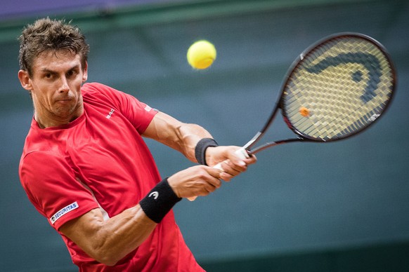 epa07840486 Henri Laaksonen of Switzerland in action against Andrej Martin of Slovakia during the Davis Cup Europe/Africa Group I first round tie between Slovakia and Switzerland in Bratislava, Slovak ...