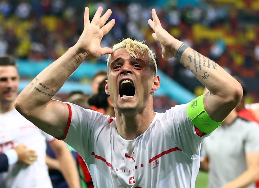 epa09309776 Granit Xhaka of Switzerland reacts after winning the UEFA EURO 2020 round of 16 soccer match between France and Switzerland in Bucharest, Romania, 28 June 2021. EPA/Marko Djurica / POOL (R ...