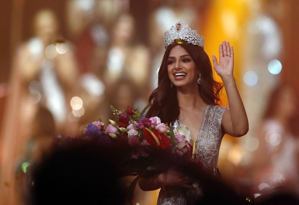 epa09639620 Miss India Harnaaz Sandhu smiles after being crowned Miss Universe during the Miss Universe 2021 pageant in Eilat, Israel, 13 December 2021. Contestants from 80 countries and territories h ...