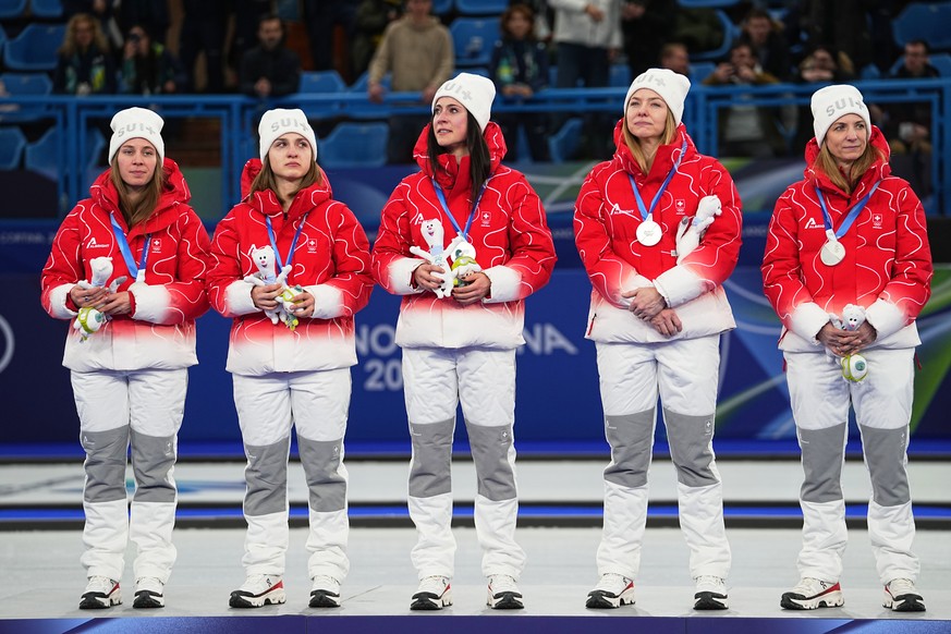 Team Switzerland poses after winning the women's curling silver medal, at the 2026 Winter Olympics, in Cortina d'Ampezzo, Italy, Sunday, Feb. 22, 2026.(AP Photo/Fatima Shbair)
Milan Cortina  ...