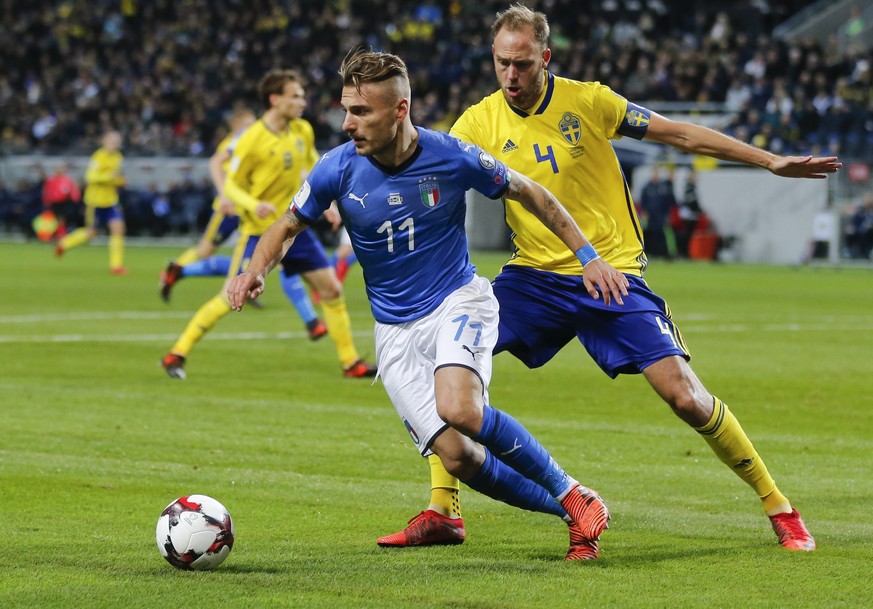 Italy&#039;s Ciro Immobile, left, is chased by Sweden&#039;s Andreas Granqvist during the World Cup qualifying play-off first leg soccer match between Sweden and Italy, at the Friends Arena in Stockho ...