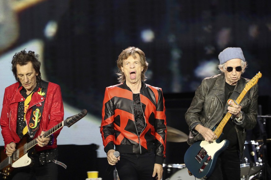FILE - Ronnie Wood, left, Mick Jagger, center, and Keith Richards, of the Rolling Stones play on stage at the Anfield stadium in Liverpool, England, during a concert as part of their &quot;Sixty&quot; ...