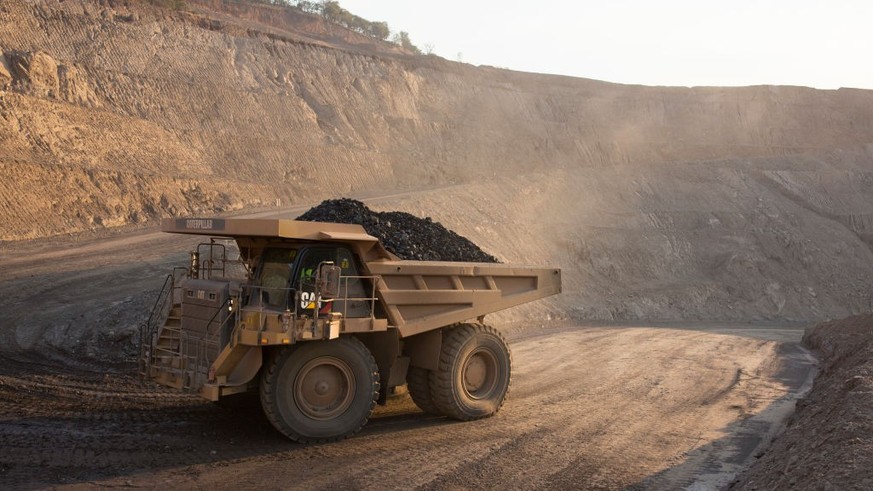 KOLWEZI, DRC- JULY 7: The sun sets on one of the open pit copper mines at Mutanda Mining Sarl on July 6, 2016 in Kolwezi, DRC. The mine is owned (69%) by Glencore, an Anglo-Swiss multinational commodi ...