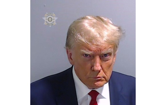 This booking photo provided by the Fulton County Sheriff?s Office shows former President Donald Trump on Thursday, Aug. 24, 2023, after he surrendered and was booked at the Fulton County Jail in Atlan ...