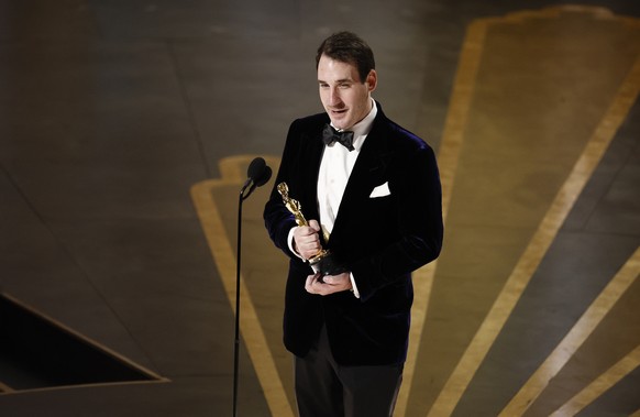 epa10518669 James Friend after winning the Oscar for Best Cinematography for 'All Quiet on the Western Front' at the 95th Annual Academy Awards Ceremony at the Dolby Theater in Hollywood, Los Angeles...