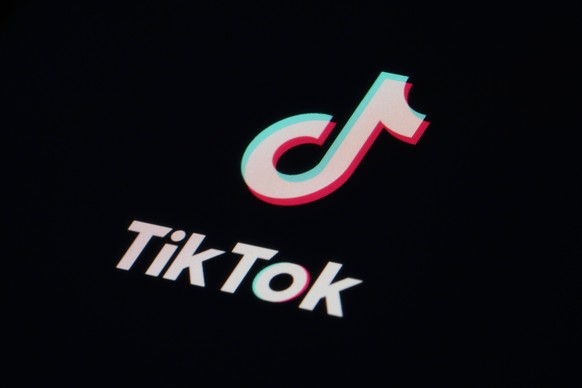 FILE - The icon for the video sharing TikTok app is seen on a smartphone, Tuesday, Feb. 28, 2023, in Marple Township, Pa. TikTok was dismissive Wednesday, March 15, of reports that the Biden administr ...