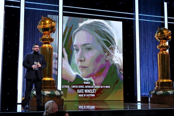 epa09676586 A handout photo made available by Getty Images North America showing HFPA Grantee and Outfest Executive Director Damien S. Navarro presents the Best Actress in a Limited Series or TV Movie ...