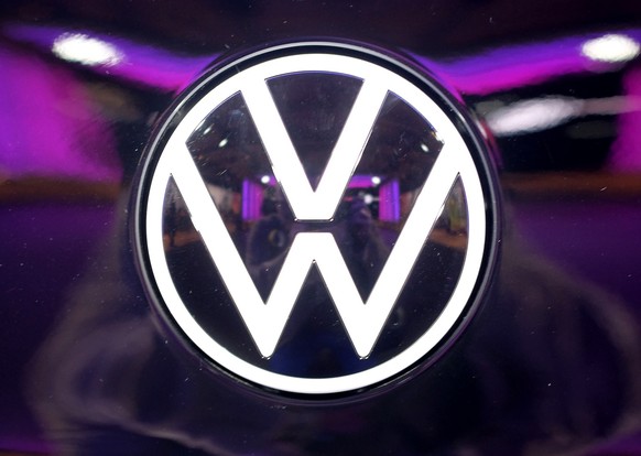 File---Picture taken on Nov.4, 2019 shows the VW logo on a car at a VW factory opening ceremony for electric cars in Zwickau, Germany. (Sebastian Willnow/dpa via AP)