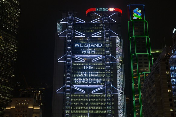 epa05983784 A message of solidarity to the victims of the Manchester attack is displayed on the the HSBC building in Hong Kong, China, 23 May 2017. According to a statement by the Greater Manchester P ...