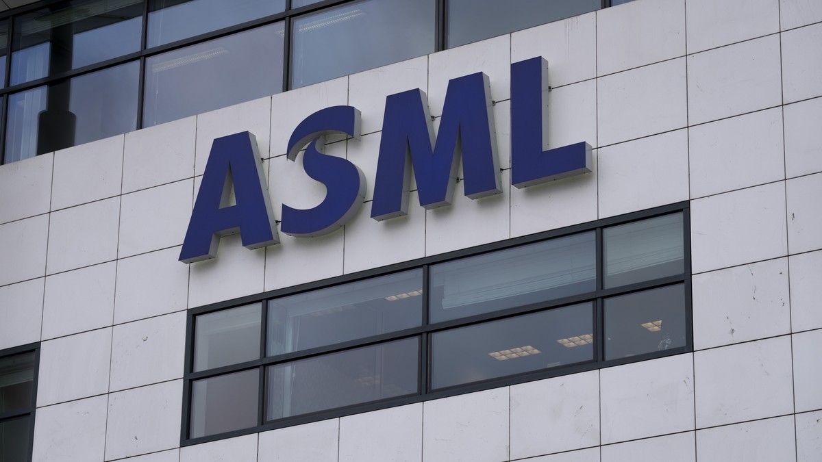 FILE - the logo of ASML, a leading maker of semiconductor production equipment, hangs on the head office in Veldhoven, Netherlands, Monday, Jan. 30, 2023. China?s foreign minister appealed Tuesday, Ja ...