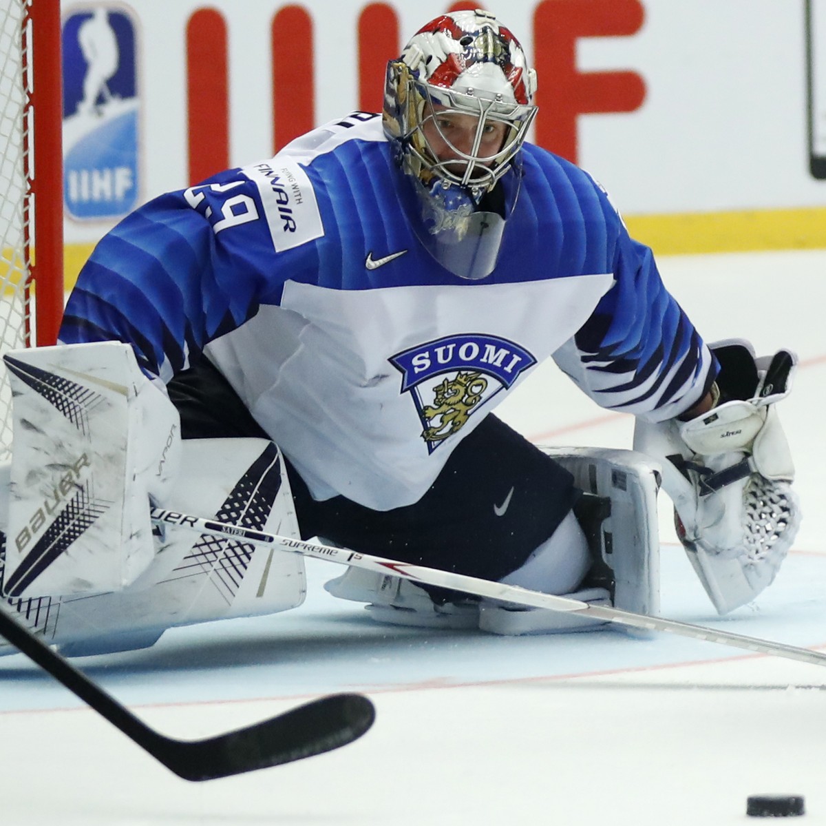 Finland's Miro Heiskanen, center, and Finland's goalkeeper Harri Sateri, left, try to stop Canada's Ryan Nugent-Hopkins, right, during the Ice Hockey World Championships group B match b ...