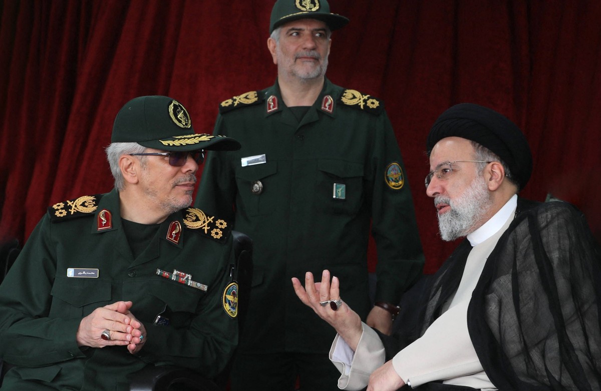 Annual Army Day - Tehran Major General Mohammad Bagheri, the Chief of Staff of the Armed Forces of the Islamic Republic of Iran L and Iran s President Ebrahim Raisi attends a military parade alongside ...