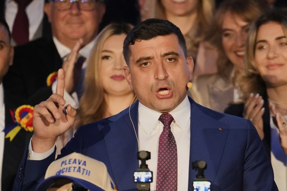 Presidential candidate George Simion speaks to media after polls closed for the second round of the country&#039;s presidential election redo in Bucharest, Romania, Sunday, May 18, 2025. (AP Photo/Vad ...