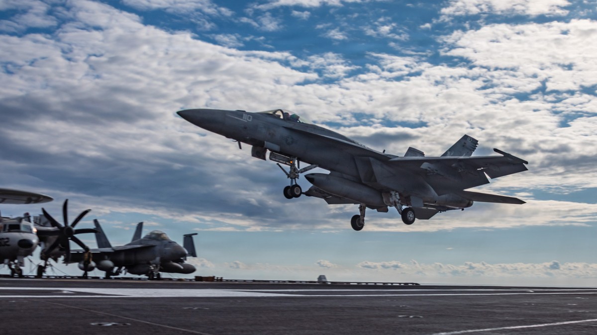 This image provided by U.S. Central Command shows a F/A-18E Super Hornet landing on the USS Gerald R. Ford (CVN 78) in support of Operation Epic Fury, on Sunday, March 1, 2026. (U.S. Navy via AP)
Iran ...