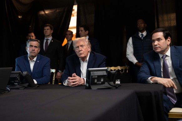 In this photo released by the White House, President Donald Trump monitors U.S. military operations in Venezuela, with CIA Director John Ratcliffe, left, and Secretary of State Marco Rubio at Mar-a-La ...