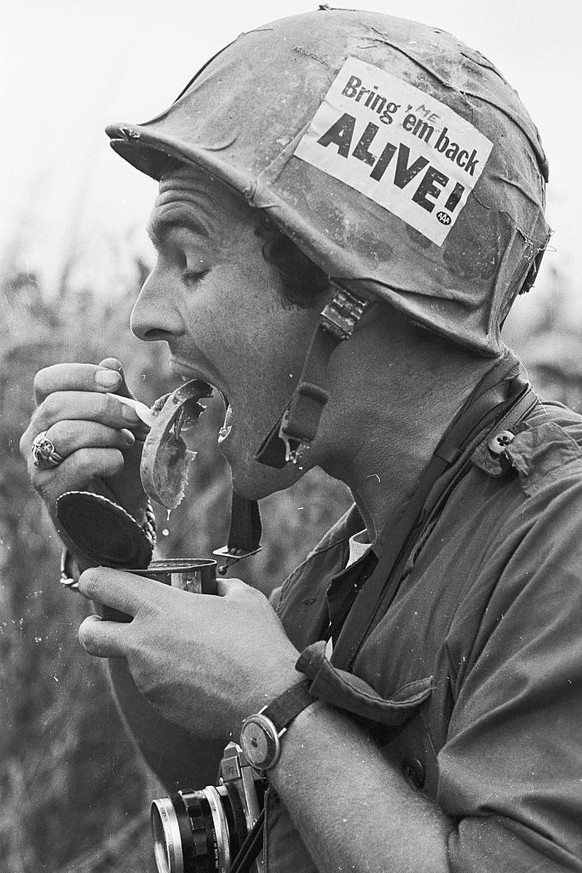 (Original Caption) Here, a U.S. Marine corps member just has one significant slogan pasted on his helmet. This marine was in a battle, fighting North Vietnamese Regulars about 20 miles south of Da Nan ...