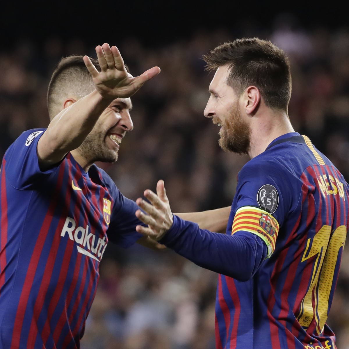 Barcelona's Lionel Messi celebrates with Barcelona's Jordi Alba after scoring his side's third goal during the Champions League semifinal, first leg, soccer match between FC Barcelona a ...