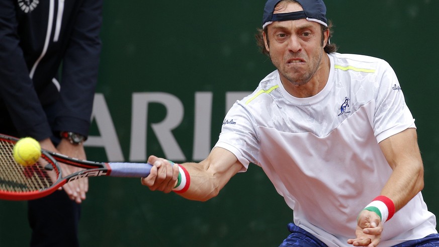 epa05327146 Paolo Lorenzi of Italy in action against Carlos Berlocq of Argentina during their men&#039;s single first round match at the French Open tennis tournament at Roland Garros in Paris, France ...