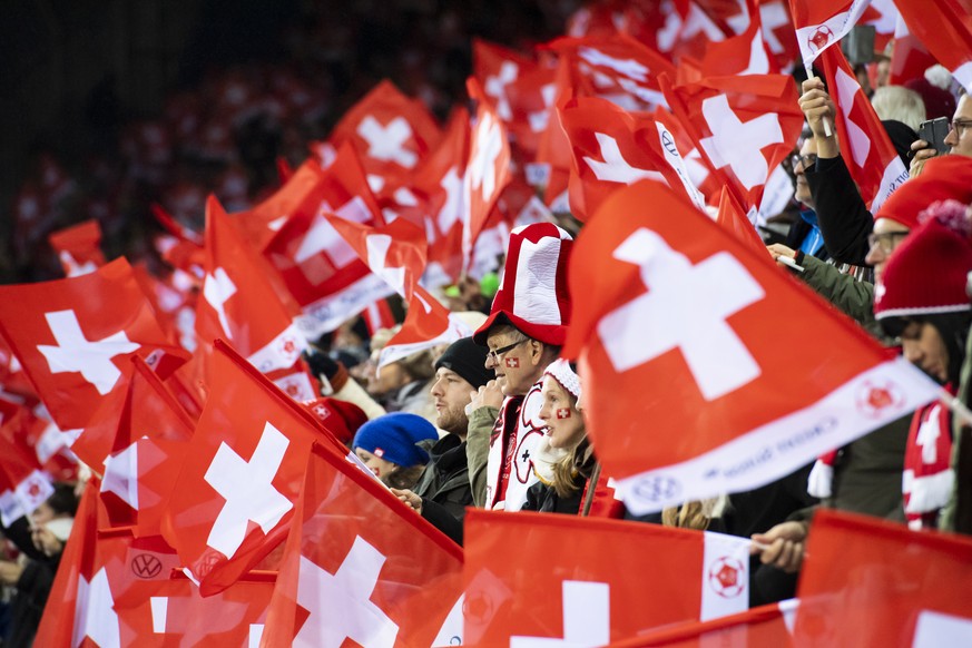 Fans cheer during the 2022 FIFA World Cup European Qualifying Group C match between Switzerland and Bulgaria at the Swissporarena stadium in Lucerne, Switzerland, Monday, November 15, 2021. (KEYSTONE/ ...