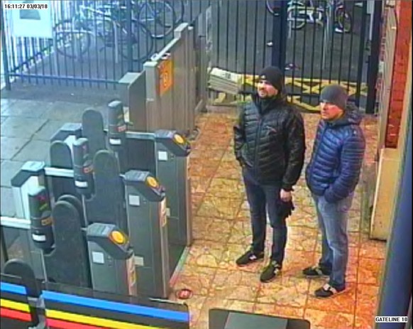 epa06998336 An undated handout photo made available by the British London Metropolitan Police (MPS) showing both suspects, Alexander Petrov (R) and Ruslan Boshirov (L), at Salisbury train station at 1 ...