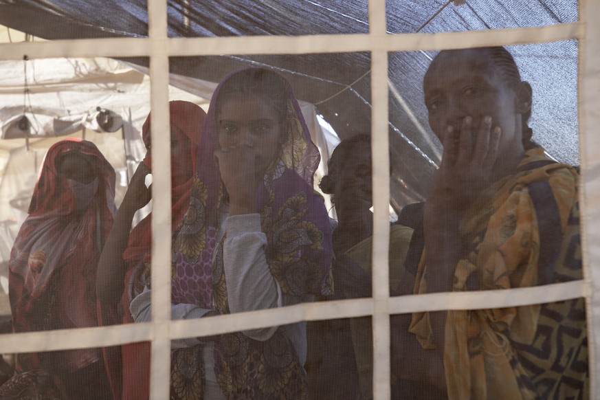 Tigray refugees who fled a conflict in the Ethiopia&#039;s Tigray region, wait their turn for treatment at a clinic run by MSF (Doctors Without Borders) in Village 8, the transit center near the Lugdi ...