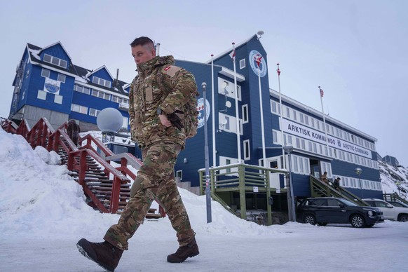 A Danish serviceman walks in front of Joint Arctic Command center in Nuuk, Greenland, on Friday, Jan. 16, 2026. (AP Photo/Evgeniy Maloletka)
APTOPIX Greenland Daily Life