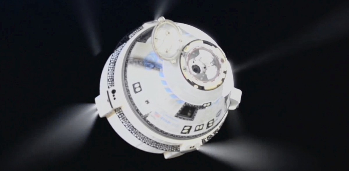 In this image from video provided by NASA, the unmanned Boeing Starliner capsule fires its thrusters as it pulls away from the International Space Station on Friday, Sept. 6, 2024. (NASA via AP)
