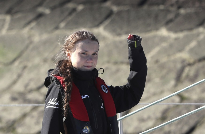 Climate activist Greta Thunberg waves as she arrives in Lisbon aboard the sailboat La Vagabonde Tuesday, Dec 3, 2019. Climate activist Greta Thunberg has arrived by catamaran in the port of Lisbon aft ...