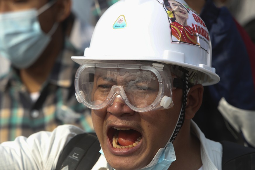 In this Feb. 28, 2021, file photo, a protester shouts slogans during a protest against the military coup in Yangon, Myanmar. Myanmar&#039;s security forces have killed scores of demonstrators protesti ...