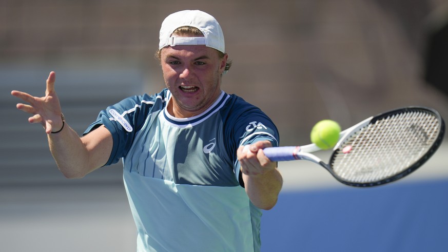 Dominic Stricker, of Switzerland, returns a shot to Stefanos Tsitsipas, of Greece, during the second round of the U.S. Open tennis championships, Wednesday, Aug. 30, 2023, in New York. (AP Photo/Manu  ...