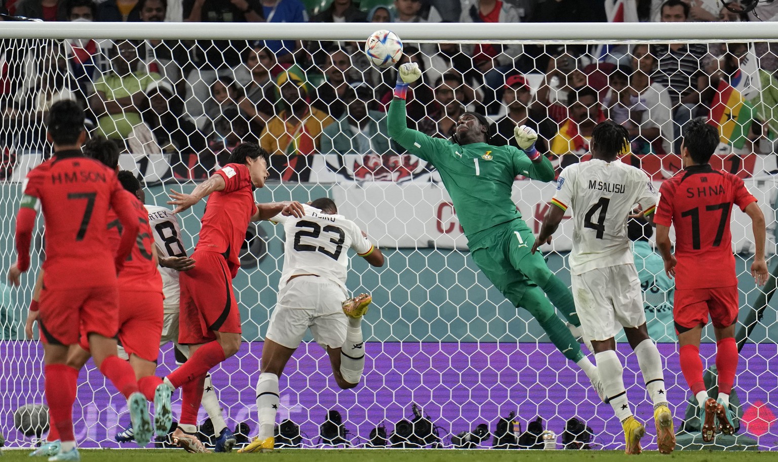 Ghana's goalkeeper Lawrence Ati-Zigi, center, makes a save during the World Cup group H soccer match between South Korea and Ghana, at the Education City Stadium in Al Rayyan, Qatar, Monday, Nov. 28,  ...