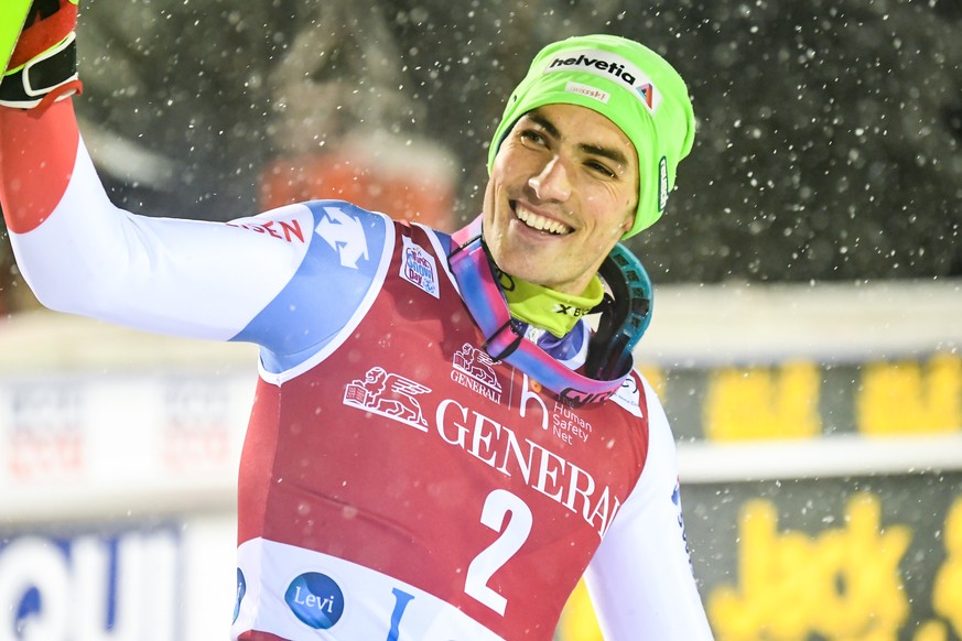 epa08022054 Daniel Yule of Switzerland celebrates on the podium after taking the third place in the Men&#039;s Slalom race at the FIS Alpine Skiing World Cup in Levi, Finland, 24 November 2019. EPA/KI ...