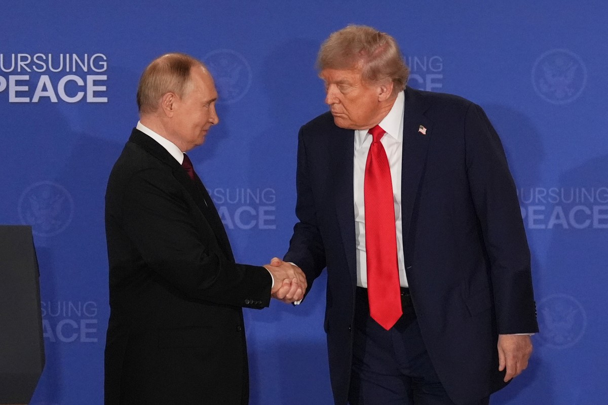 FILE - President Donald Trump, right, shakes the hand of Russia's President Vladimir Putin during a joint press conference at Joint Base Elmendorf-Richardson, Alaska, Aug. 15, 2025. (AP Photo/Jae ...