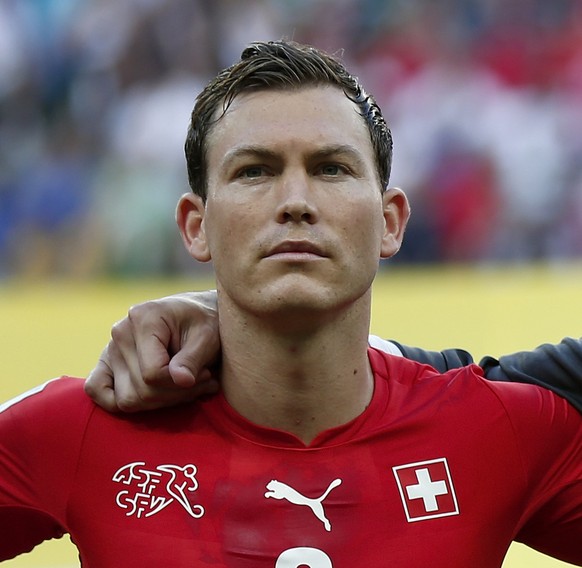 From left: Switzerland&#039;s Stephan Lichtsteiner, goalkeeper Diego Benaglio and Goekhan Inler listen to the national anthem prior to the group E preliminary round match between Switzerland and Franc ...