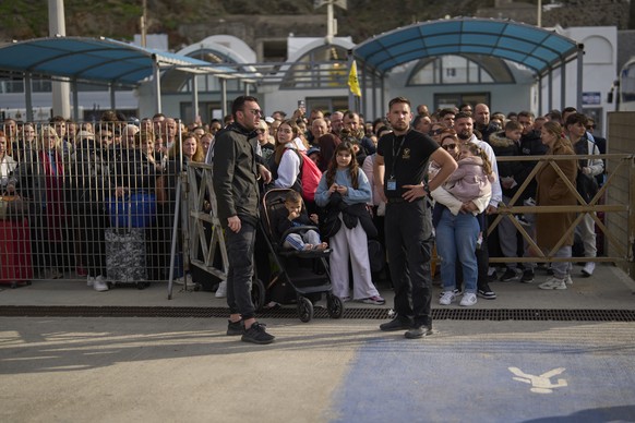 Passengers wait for the arrival of a regularly scheduled ferry to Athens&#039; port of Piraeus, after a spike in seismic activity raised concerns about a potentially powerful earthquake in Santorini,  ...
