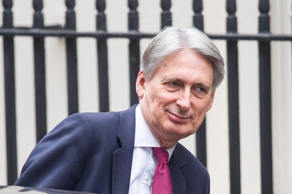 epa07166883 British Chancellor of the Exchequer Philip Hammond leaves 11 Downing Street, Central London, Britain, 15 November 2018. British Prime Minister Theresa May is facing pressure after two of h ...