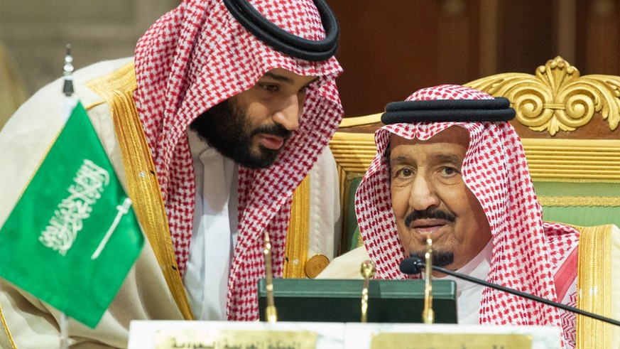 In this photo released by the state-run Saudi Press Agency, Saudi Crown Prince Mohammed bin Salman, left, speaks to his father, King Salman, right, at a meeting of the Gulf Cooperation Council in Riya ...