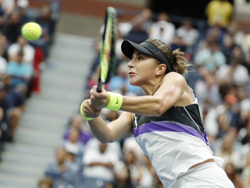 epa07813376 Belinda Bencic of Switzerland hits a return to Naomi Osaka of Japan during their match on the eighth day of the US Open Tennis Championships the USTA National Tennis Center in Flushing Mea ...