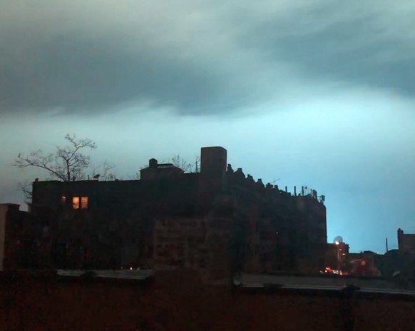 In this image taken from video, the night sky is illuminated in a bright, blue color after an explosion in the Queens borough of New York, Thursday, Dec. 27, 2018. New York police say a transformer ex ...