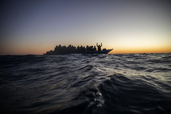 FILE - Migrants and refugees wait for assistance on an overcrowded wooden boat in the Mediterranean Sea off the Libyan coast, Feb. 12, 2021. (AP Photo/Bruno Thevenin, File)
Vatican Pope Francis Obit M ...