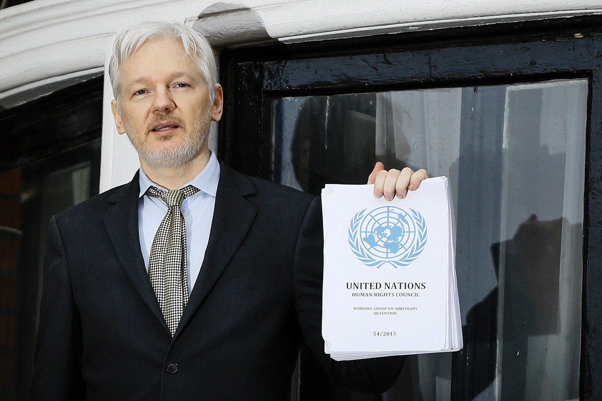FILE - WikiLeaks founder Julian Assange speaks on the balcony of the Ecuadorean Embassy in London, Feb. 5, 2016. Assange will plead guilty to a felony charge in a deal with the U.S. Justice Department ...