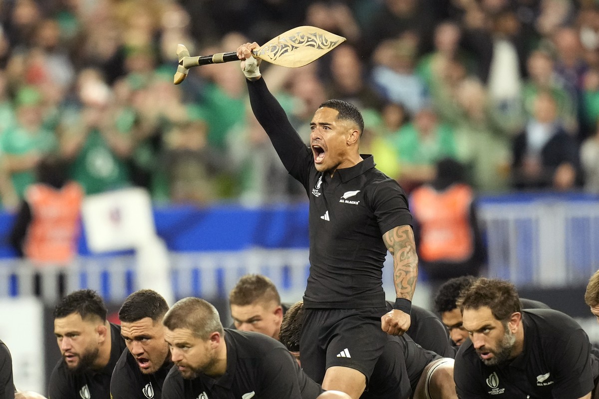 New Zealand's Aaron Smith leads the team as they perform the Haka just prior to the start of the Rugby World Cup quarterfinal match between Ireland and New Zealand at the Stade de France in Saint ...