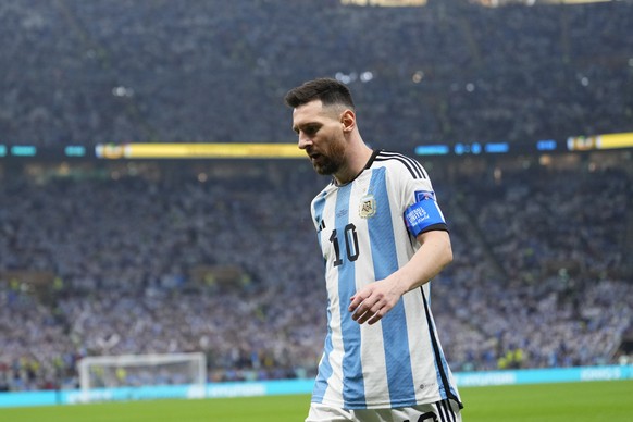 Argentina&#039;s Lionel Messi walks on the field during the World Cup final soccer match between Argentina and France at the Lusail Stadium in Lusail, Qatar, Sunday, Dec.18, 2022. (AP Photo/Manu Ferna ...