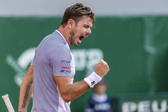 Stanislas &quot;Stan&quot; Wawrinka, of Switzerland, reacts after winning a point to Damir Dzumhur, of Bosnia and Herzegovina, during their second round match, at the ATP 250 Geneva Open tournament in ...